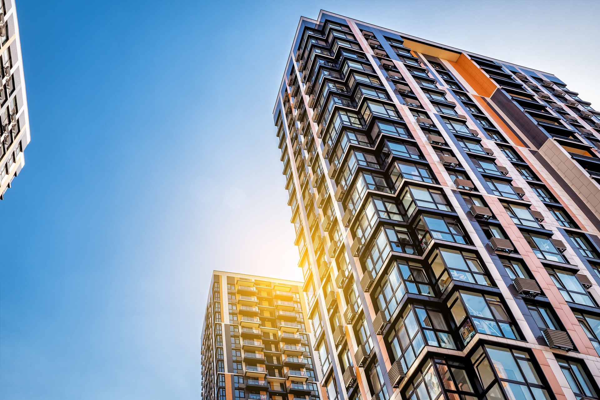 Modern tower buildings or skyscrapers under blue sky at sunset